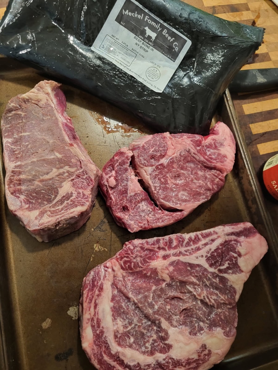A vacuum-sealed package of Meckel Family Beef Co. beef on a tray